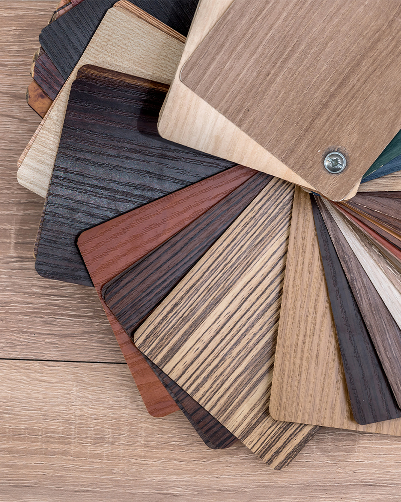 A collection of wood species and stain samples showing the available colors, grain patterns and finish options for custom Amish furniture.